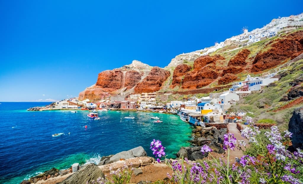 The-old-harbor-of-Ammoudi-under-the-famous-village-of-Ia-at-Santorini-Greece.-min